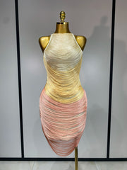 Mannequin wearing a multicolored dress with a plain background