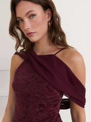 Woman wearing a burgundy lace dress
