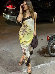 Diagonal collar plum blossom print asymmetrical hem dress worn outdoors