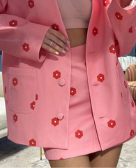Pink outfit with red floral patterns