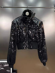 Black sequin jacket on a hanger against a neutral background