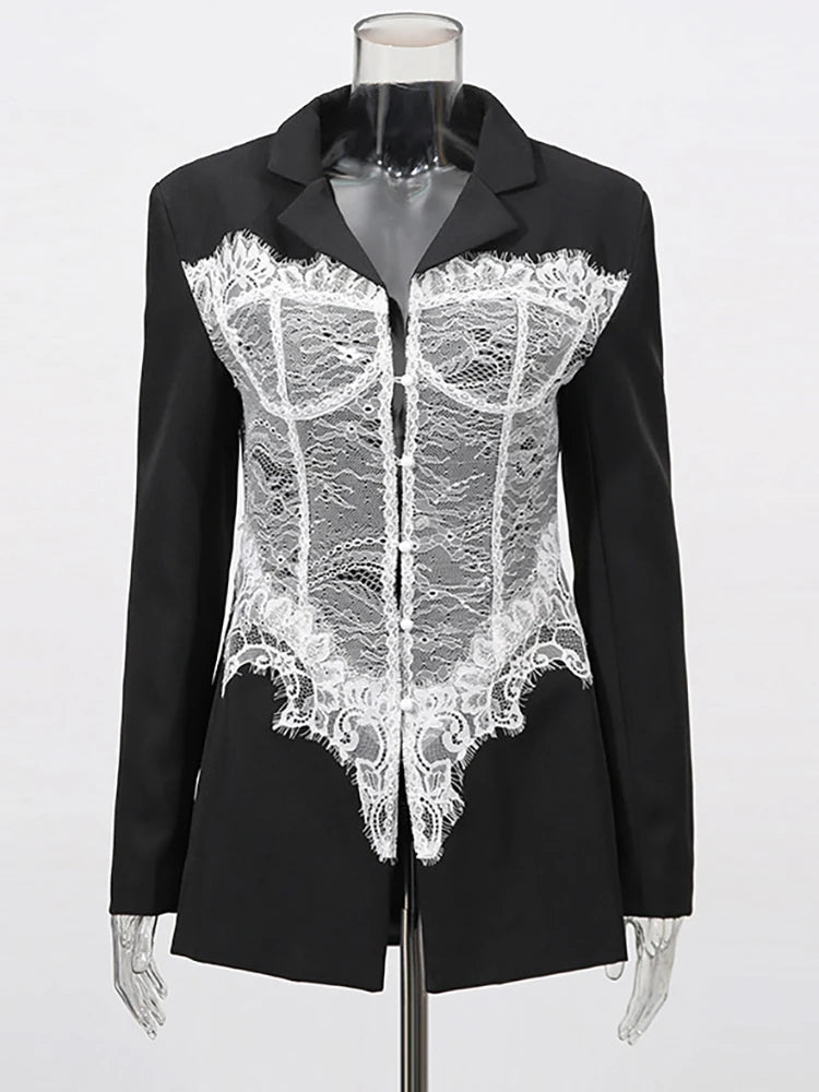 Black blazer with white lace detailing on a mannequin against a white background