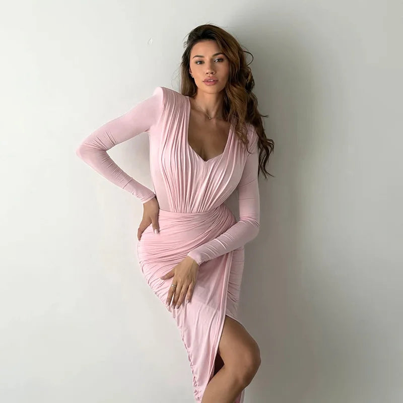 Model wearing pink ruched V-neck top and skirt set