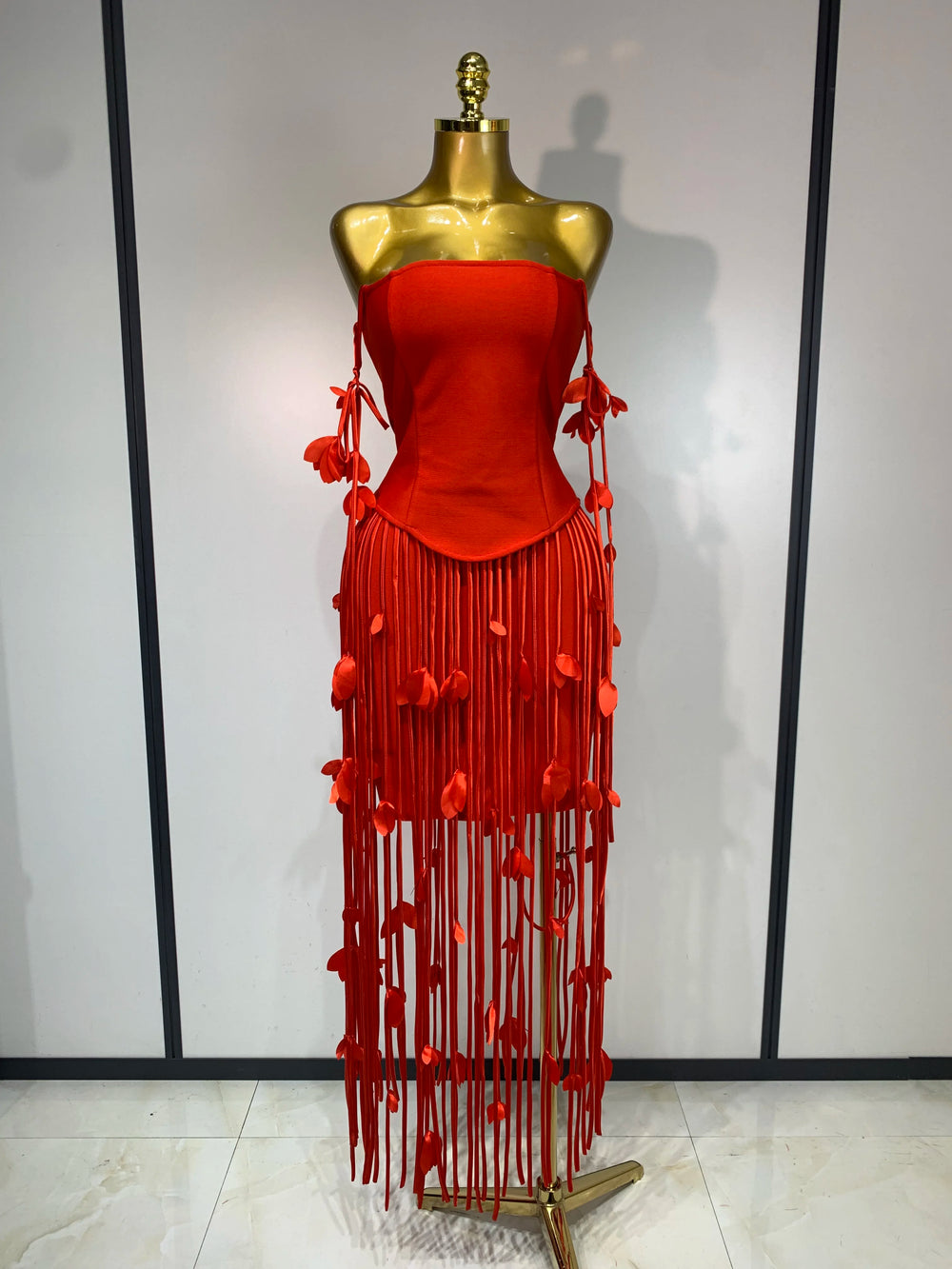 Red strapless bodycon mini dress with tassel trim