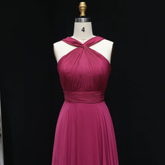 Magenta dress on a mannequin against a black background