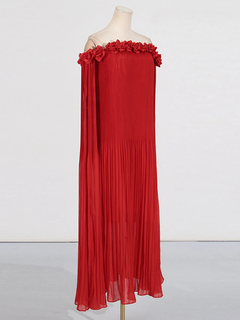 Red floral embellished off-the-shoulder maxi dress on mannequin