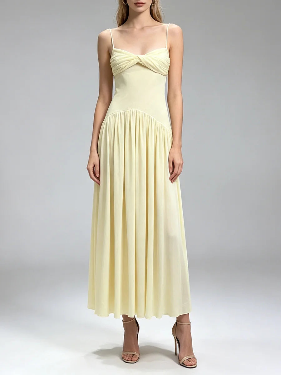 Close up of the fabric texture on a ruched twist front midi dress