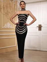 Black strapless beaded maxi dress.