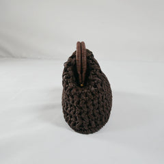 Coffee woven handbag on a white background