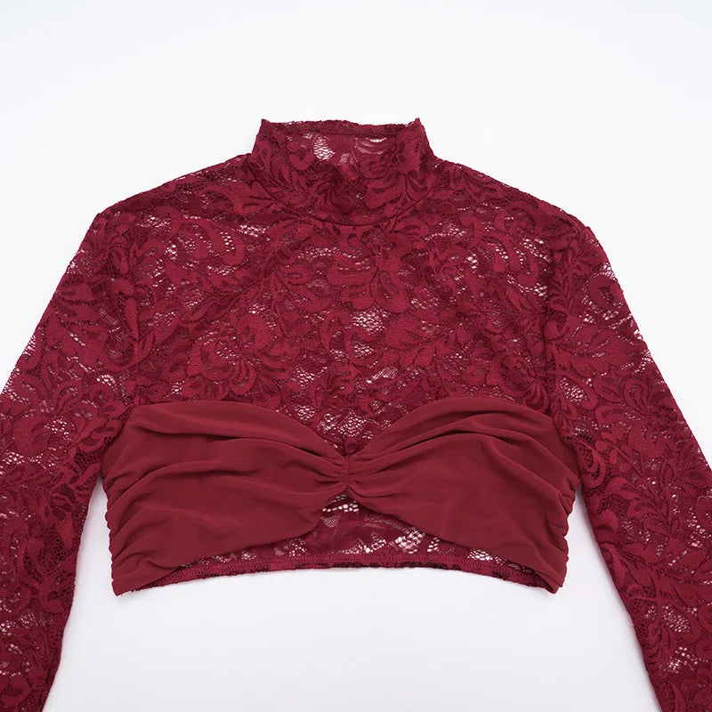 Red lace top with a bow detail on a white background