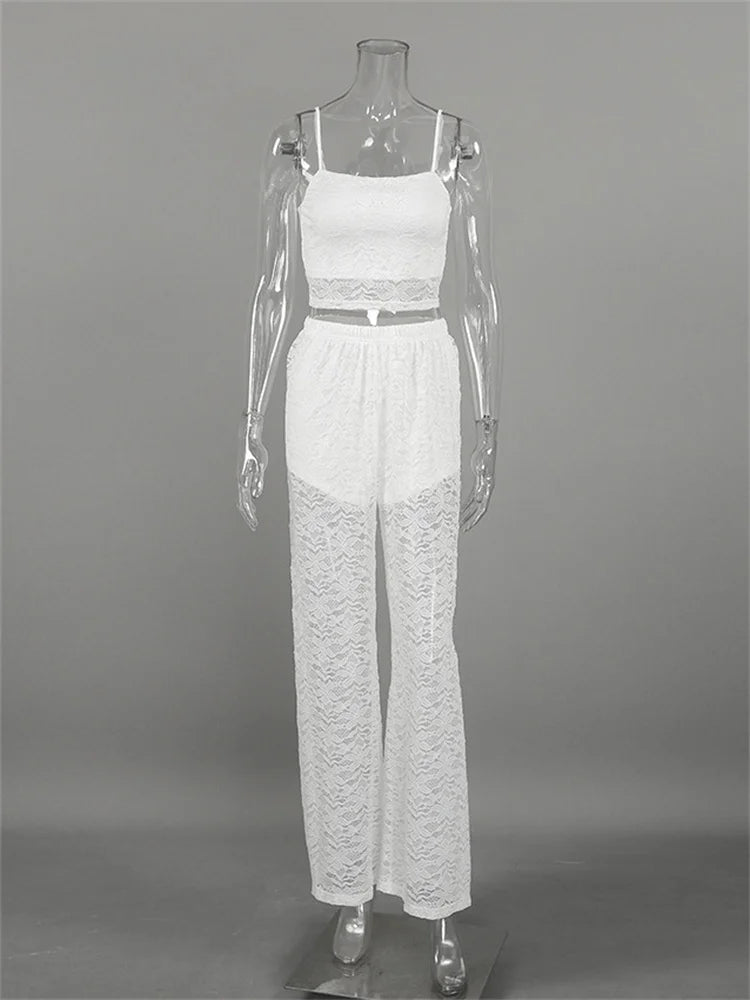 White lace jumpsuit on a mannequin against a gray background