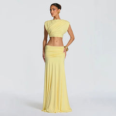 Woman wearing a yellow outfit on a plain background