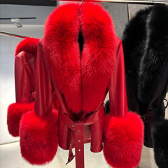 Red fur coat with matching fur trim on a hanger.