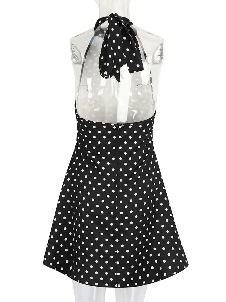 Black polka dot apron with a white background