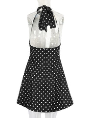 Black polka dot apron with a white background