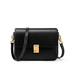 Black handbag with gold clasp on a white background
