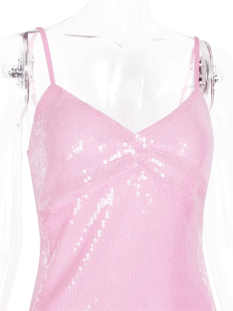 Pink sequin dress on a mannequin against a white background