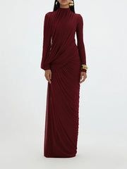 Maroon evening gown with long sleeves on a white background