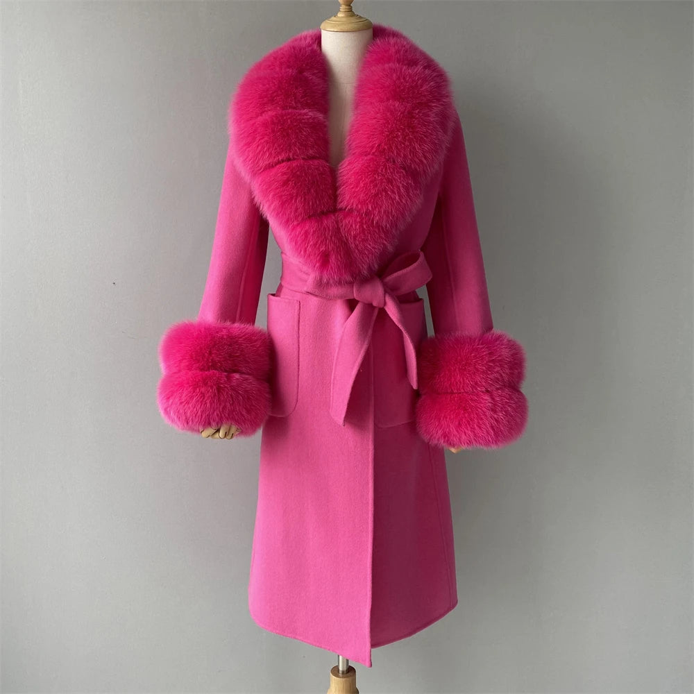 Pink coat with fur accents on a mannequin against a gray background