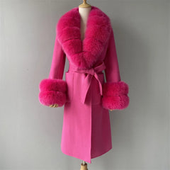 Pink coat with fur accents on a mannequin against a gray background