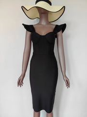 Mannequin wearing a black dress with ruffled shoulders and a wide-brimmed hat
