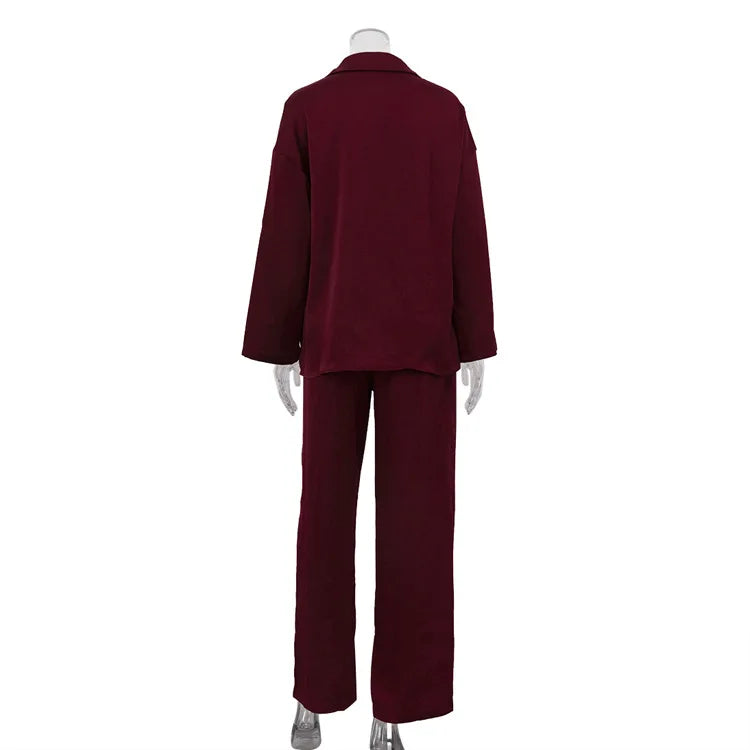 Burgundy suit on a mannequin against a white background