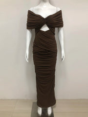 Brown evening gown on a mannequin against a white background