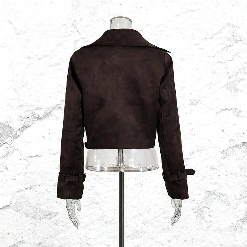 Brown jacket on a mannequin against a white marble background