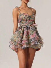 Floral dress with ruffled layers on a plain background