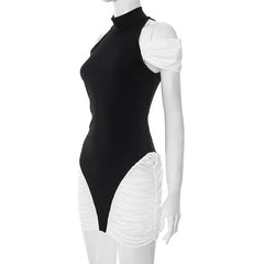 Mannequin wearing a black and white dress with a high neckline and ruffled white bottom half on a white background.