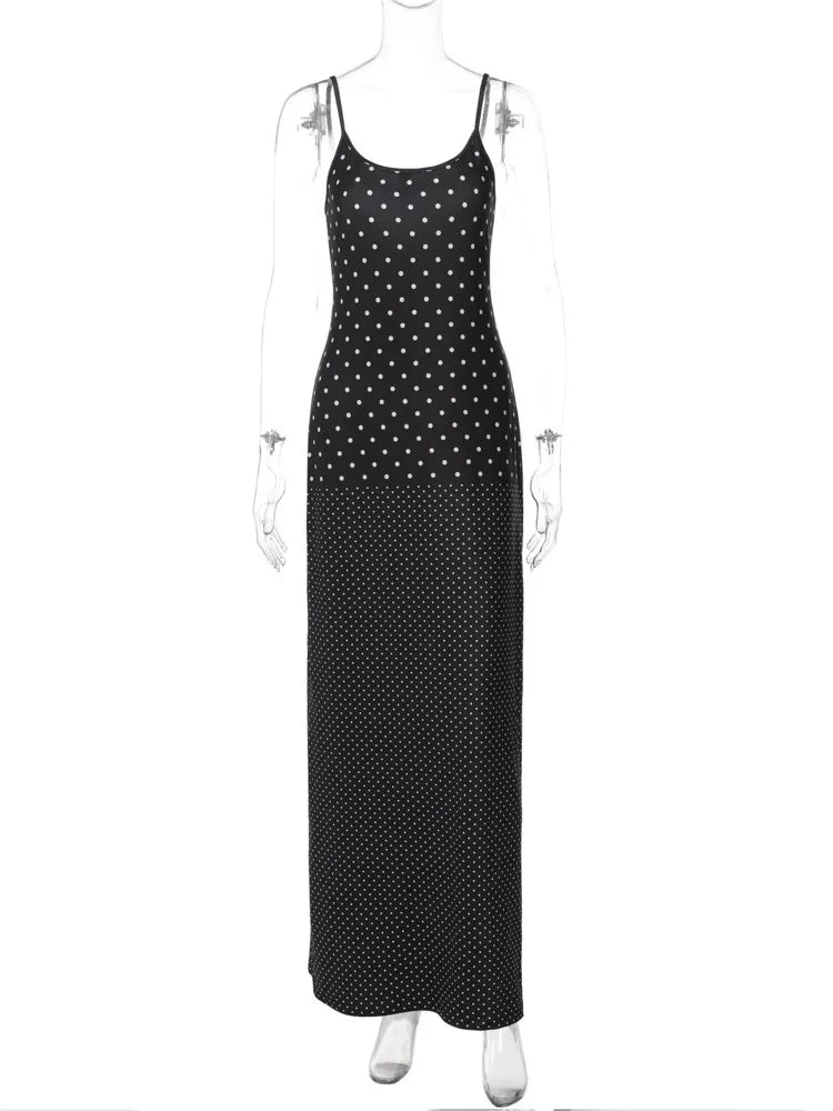 Black polka dot dress on a mannequin against a white background