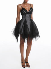 Full body view of black mesh asymmetrical v-neck mini dress
