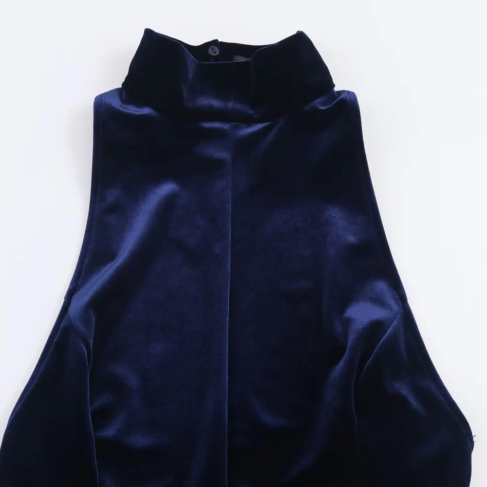 Navy blue velvet garment on a white background