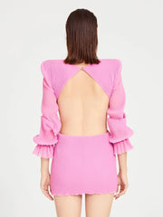 Elegant long sleeve pink mini dress styled for garden event