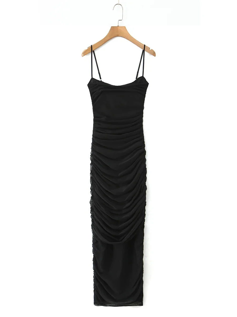 Black dress on a hanger against a white background