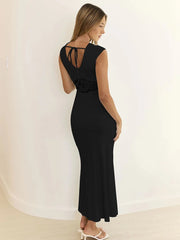 Woman wearing a black dress with a white background