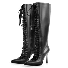 Side profile of lace-up pointed toe knee-high boots in black faux leather