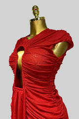 Red dress on a mannequin against a gray background