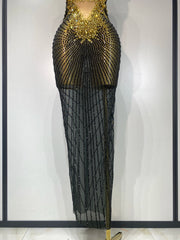 Black beaded evening gown on a mannequin against a white background