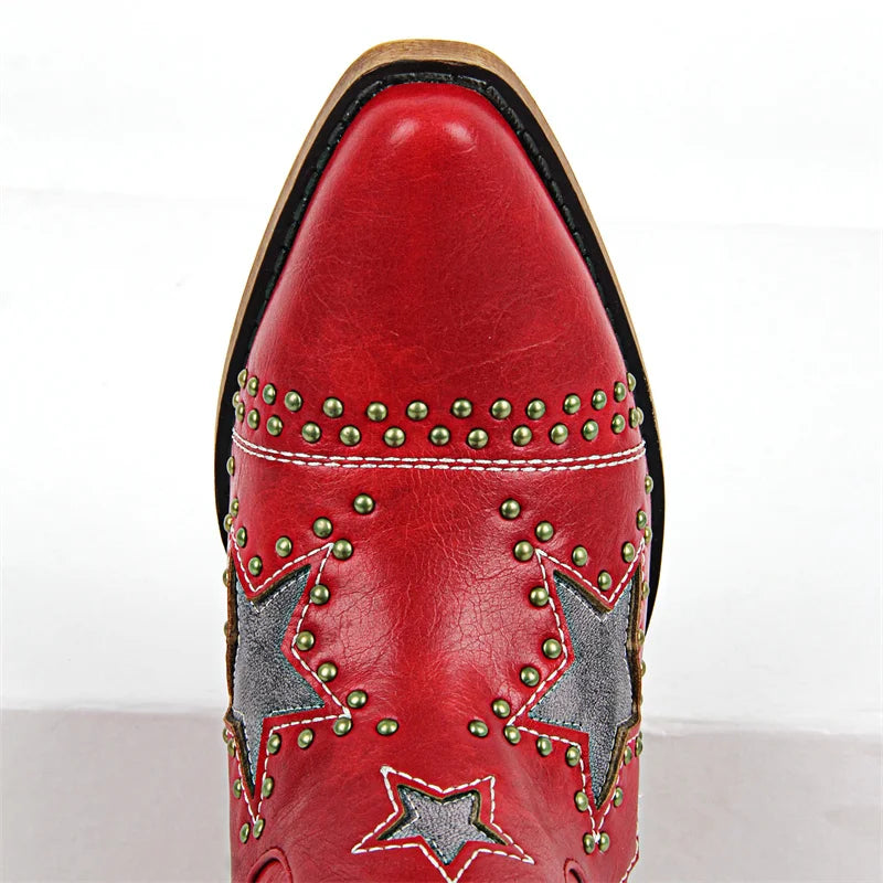 Red cowboy boot with star designs and gold studs on a white background