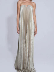 Silver strapless gown on a plain background