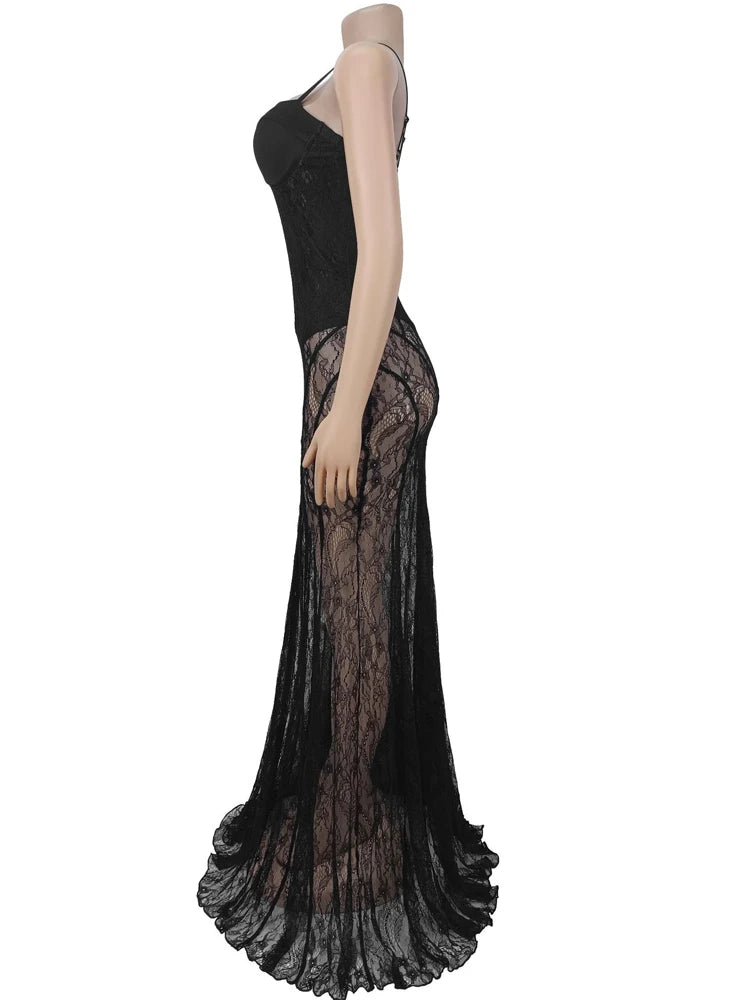 Mannequin wearing a black evening gown with sheer overlay on a white background