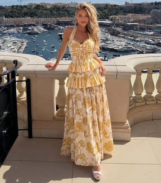 Yellow patterned halter neck top and tiered skirt swimwear set