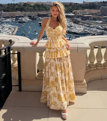 Yellow patterned halter neck top and tiered skirt swimwear set
