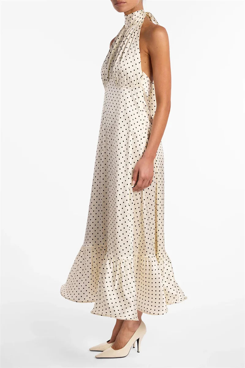 Woman wearing a polka dot dress on a white background