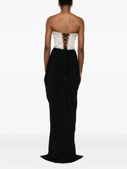 Black strapless gown with lace-up back on a white background