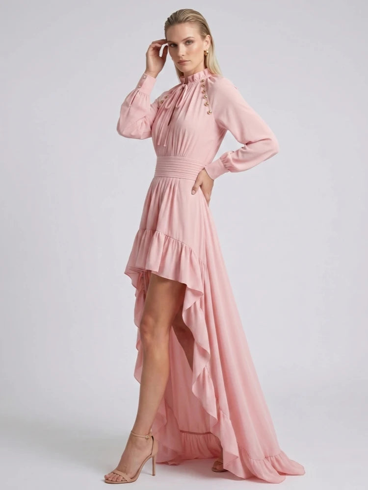 Detail of ruffled hem on pink high-low dress