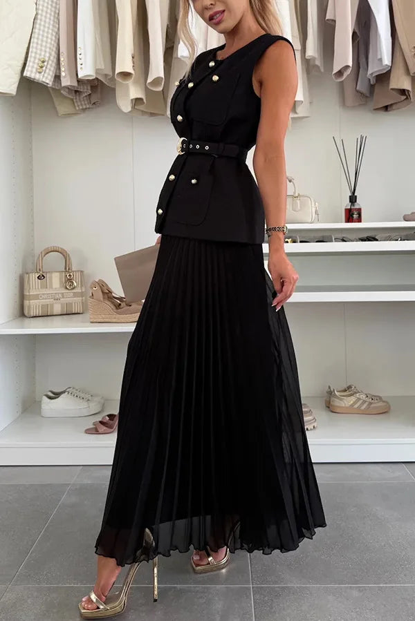 Woman wearing a black dress with gold buttons in a clothing store.