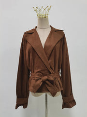 Brown jacket with a belt on a mannequin against a plain background