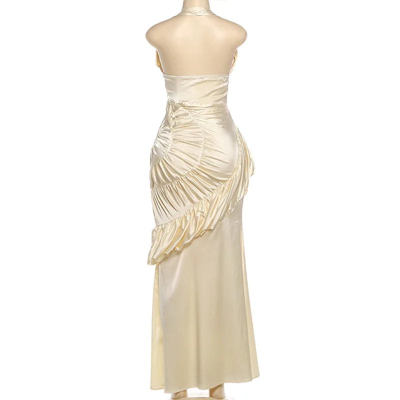 Beige evening gown on a mannequin against a white background